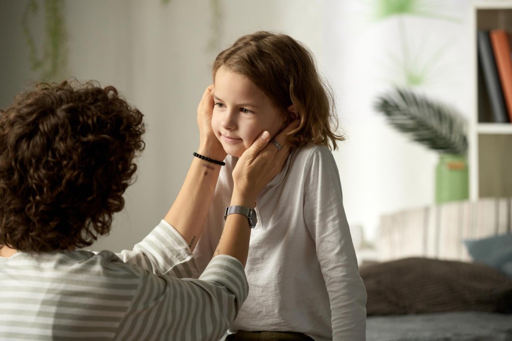 Mom correcting daughter with love