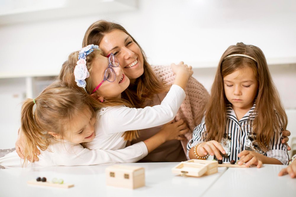 Mom and girls playing