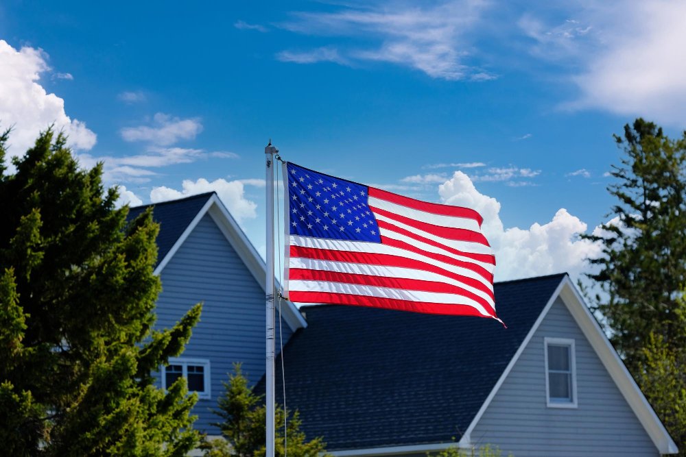 American flag near american houses