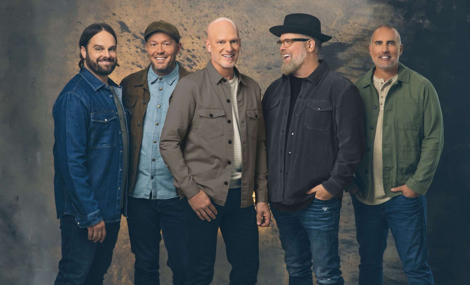 The members of MercyMe in a recent studio photo, continuing their legacy in Christian music.