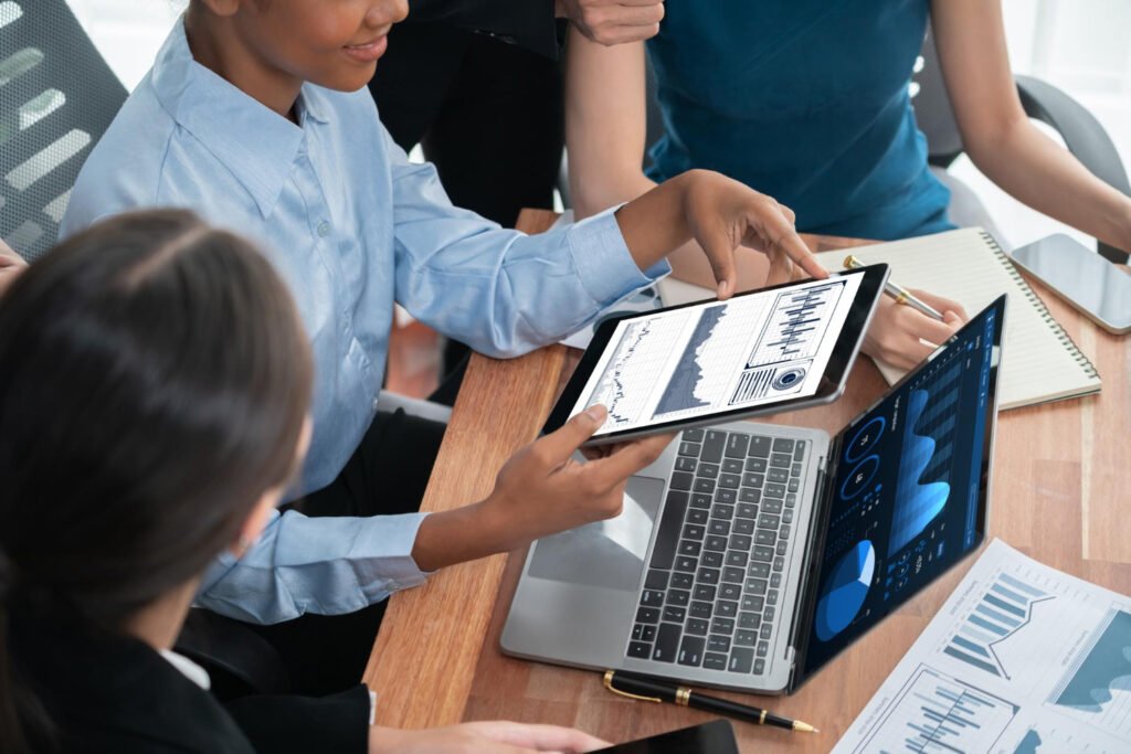 Three facility service managers using AI to review SLA data in a control room