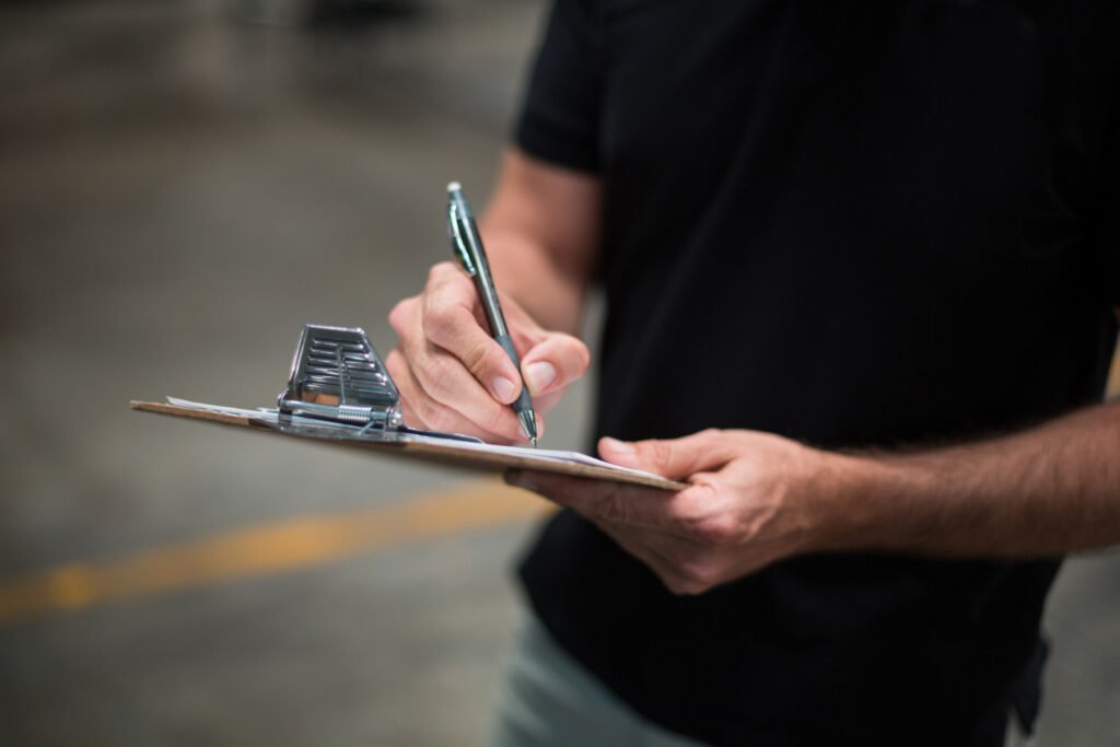 School facility manager reviewing checklist for partner evaluation